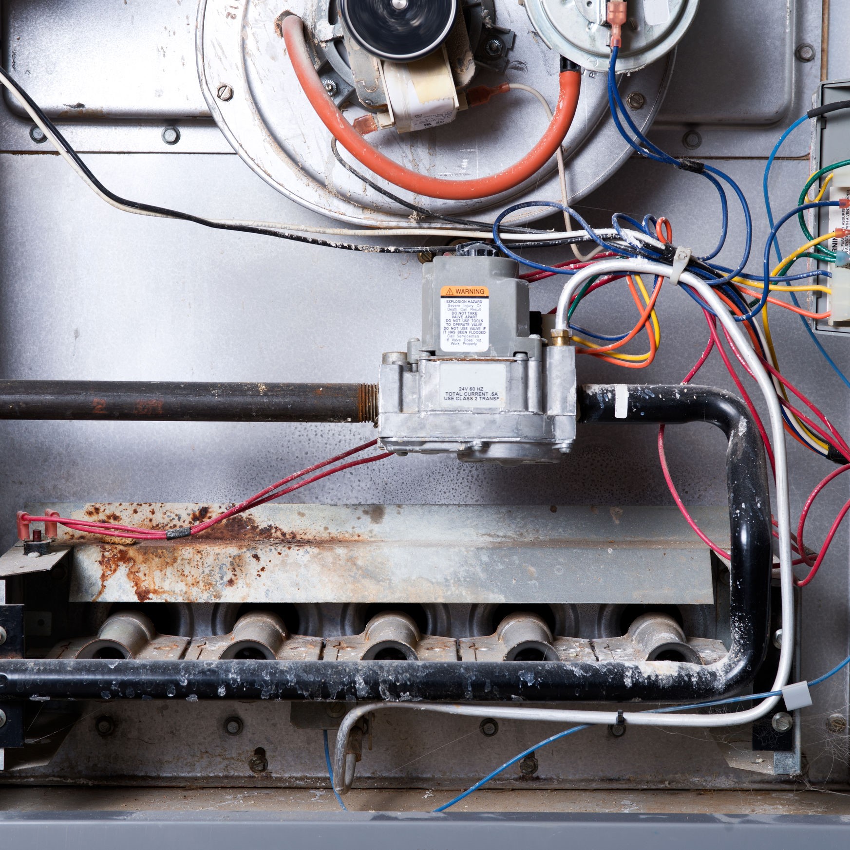 The inside of a dirty heater that needs to be serviced.